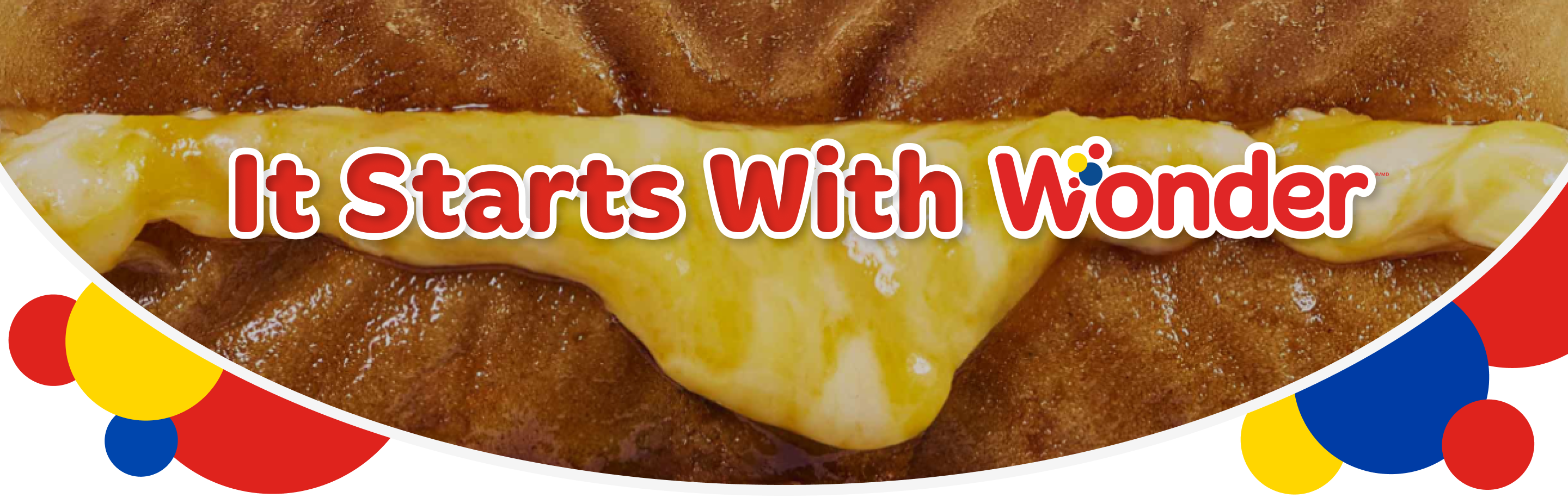 Bread with cheese and text 'It Starts With Wonder'